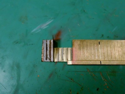 Soldering of face to edge. On the left portion of pieces attached the tinning is still present. The right portion has been cleaned up with sand paper.