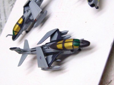 Years ago I was "gigged" at a competition for having out of scale pigment on the gold canopy of a prowler.  A lesson I never forgot, and now use some paint meant for wargaming that has zero "flakes" in the gold.  Never thought I would find myself in that section of my LHS.