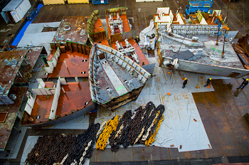 BREMERTON, Wash. (Nov. 20, 2014) Hull sections of the former USS Long Beach (CGN 9), the world�s first nuclear-powered guided missile cruiser, are arranged in dry dock 5 at Puget Sound Naval Shipyard and Intermediate Maintenance Facility. The cruiser was commissioned in 1961 and decommissioned in 1994, thus providing more than 30 years of service to the Sailors who served aboard her. PSNS &amp; IMF performs this work so the metal can be recycled and reused. (U.S. Navy Photo by Wendy Hallmark) 141120-N-GD259-049