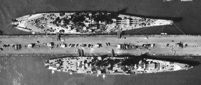 The real USS Alaska CB-1 sitting across the pier from the USS Missouri BB-63 during the late summer of 1944. These two ships worked up together which caused the Alaska to be compared against the Missouri in all aspects. This did not favor the Alaska very much.