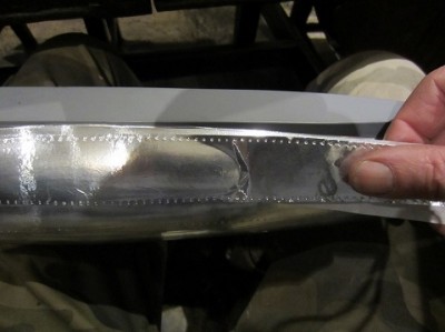 Each foil strip is laid over lapping the previous one slightly. The tape was pressed down from the centre outwards excluding air bubbles.