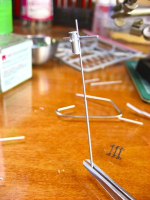 The mast has a coat of paint. There were more details on the kit part, and if I weren't on a deadline I'd have added more for visual interest, but honestly I've spent way too much time on this one assembly as it is.