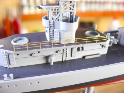 The railing is so fine that I don't want to risk mounting it on tape, priming and painting it. So I attach it first then go over it with a brush and really fine paint. It takes two passes to get it right.