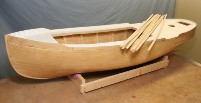 Looks the same! But now has 2 coats of glass. Half round stock for the rub rails is on deck, some 36 feet of it (including two sticks soaking in the ammonia tube).