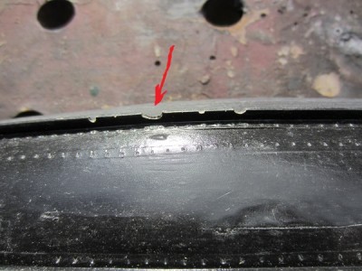 The arrow indicates the "drop outs" in the bilge keel caused by trapped bubbles. These can easily be filled.