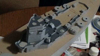 Closer view of superstructure. Drilled out citadel portholes but got slightly carried away on one of them. Windows are looking rough because while the citadel piece itself has them molded open, the pancake that goes on top has them molded as a solid piece. Drilling was...less than perfect. Starboard windows will be drilled out once platform is glued in place.