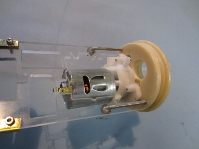The pump is mounted on the inside of the forward end bung. The input/outlet passes straight through the bung wall.