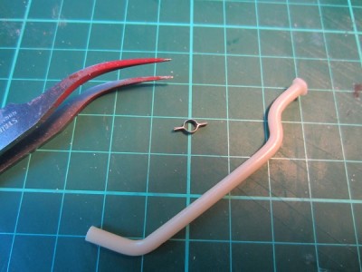 Here is one of the engine breather pipes. These have the same mounting brackets as the exhaust, made from folded aluminium sheet.
