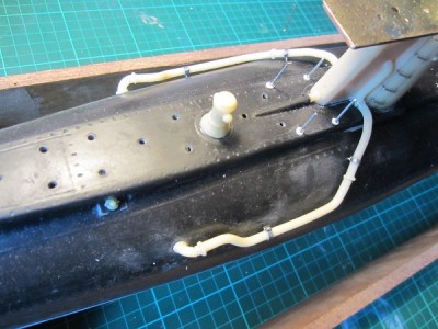The installed breather pipes and associated brackets.