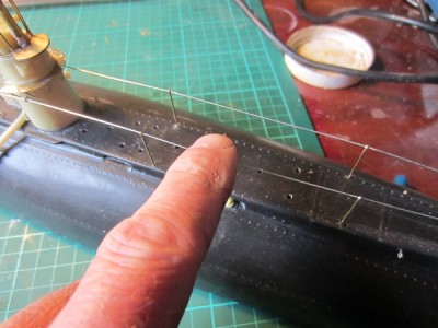 Slight pressure to the wire creates a gravity induced sag seen on contemporary pictures.