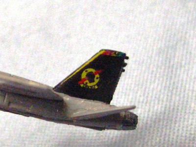 This is an example of no white under coating.  There is a yellow 'NK" on the trailing edge of the fin, pretty much invisible with out the under layer.