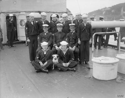 Crews poses with ship's dog