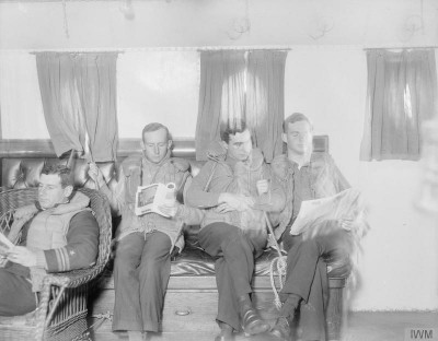 Officers relax in wardroom.