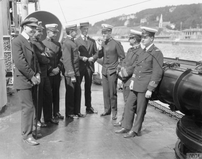 USN, RN officers on deck of a DD