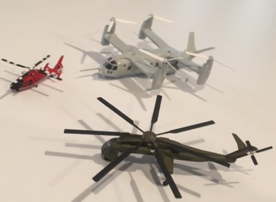 This pic shows a Super Stallion I am converting to a sky crane, all in the back ground is a kit bash making a 4 engine Osprey , I used the Trumpeter 1/350 EH 101 helicopter which much to my disappointment is out of scale.