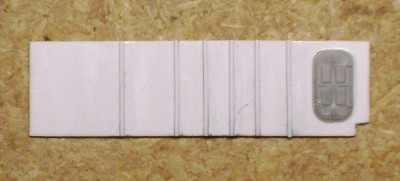 The new athwartships bulkhead was fabricated from .030 inch styrene with frames of .020 x .020 inch styrene strips.  The new compartment bulkhead did away with the port side watertight door and this door was scavenged for the new starboard side WT door.
