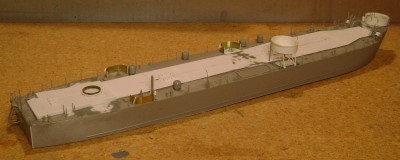 A view from starboard aft, minus the superstructure. The ladder for the elevated gun tub came from one of the kit's bow gun tub ladders.  Most of the topside details are installed.  Next comes painting.