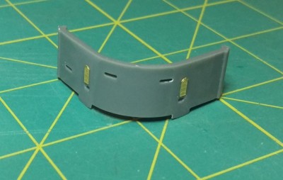 Bow bulkhead.  Replaced molded on doors with PE.  Need to fill in the attachment points where the PE platforms will go under the doors still.