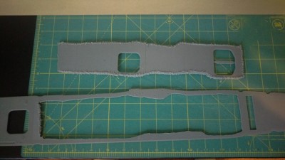 After spending too long with too little accomplished using a file, I braved the dremel on it's lowest setting and really took my time.  Edge cleanup will need to be done on the remainder of the deck still but the majority of the cutting out is done.